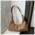 Close-up of vintage brown suede hobo bag with adjustable strap and contrast stitching - Brown