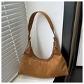 Detail of a brown faux suede tote bag with zipper closure and adjustable metal buckle - Brown Suede