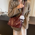 Retro burgundy leather shoulder bag with silver butterfly charms and plush pendant - Burgundy