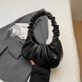 Minimalist black pleated crescent handbag with stylish knotted handle detail - Black