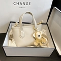 Cream white lychee leather mini bucket bag with bear charm and adjustable shoulder strap - Beige