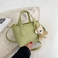 Light green litchi grain bucket bag with cute bear charm and gold hardware - Green