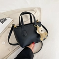 Minimalist black lychee pattern bucket bag with golden hardware and bear charm - Black