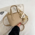 Mini khaki litchi texture bucket bag with bear pendant and adjustable strap - Khaki