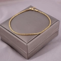 Funkelndes goldenes gewebtes Kettenarmband mit Textur und Karabinerverschluss - Gold