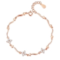 Detail of rose gold clover bracelet with crystal hearts and S925 engraved tag - Rose Gold