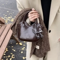 Dark brown oil wax leather mini tote bag with cat charm and sleek handles in autumn setting - With Pendant / Coffee