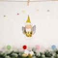 Cute Christmas angel doll with gold sequins and silver wings on a festive background - Gold