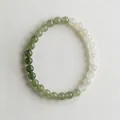 Close-up of dual-tone Nephrite Jade beads in dark green and milky white colors - Plain Gradient Nephrite Jade Bracelet