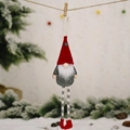 Christmas gnome hanging ornament with red star hat and striped legs on snowy background - Red Hat