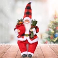 Sitting Santa Claus doll in red and black buffalo plaid outfit with gift bag and pine - Red Sitting Style