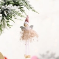 Pink plush Christmas angel girl ornament with soft knit hat and silver wings hanging on pine - Peach Pink