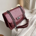 Deep red chevron quilted flap bag with gunmetal chain strap and turn-lock closure - Fuschia