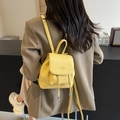 Minimalist yellow mini backpack in pebble leather with drawstring and silver accents - Yellow