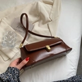 Vintage glossy dark brown baguette bag with gold metal clasp and slender shoulder strap - Brown