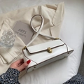 Minimalist white baguette shoulder bag with contrast brown trim and gold buckle lock - Beige