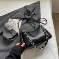 Minimalist black pleated leather shoulder bag with bold silver chain and strap - Black