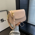 Nude pink leather crossbody flap bag with adjustable strap and gold hardware detail - Pink