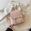 Pink glossy mini backpack for women with flap closure and cute plush charm detail - With Pendant / Pink