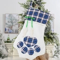 Blue buffalo plaid cat paw Christmas stocking with fish bone tags on a festive background - Blue Plaid Paw Style