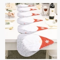 Close-up of gray felt Christmas gnome table placemats with white snowflakes on red hats - Faceless Doll Combo Style C