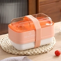 Pink two-tier portable bento box with elastic strap and seashell graphic design - Pink
