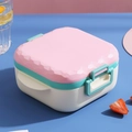 Pink and white bento box with blue side buckle and textured lid for office lunch - Pink