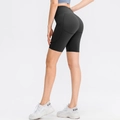 Pantaloncini yoga neri a vita alta con tasche laterali e cucitura push-up fitness - Taglia S / Pantaloni e gonne / Nero