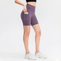 Women's high-waisted yoga shorts in dark purple with functional side pockets - 4/S / Bottoms / Hibiscus Purple
