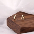 Macro shot of asymmetrical S925 gold rabbit and carrot stud earrings on wood - Rabbit Carrot Stud Earrings - Gold Color