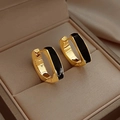 Minimalist gold U-shaped hoop earrings with black enamel inlay on jewelry box - Black
