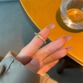 S925 interlocking silver ring with pavé crystals on a soft warm background - Adjustable Open / Gold