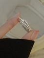 S925 sterling silver interlocking ring with sparkling zircons on a model's hand - Adjustable Open / White Gold