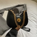 Chic black leather hobo bag with chunky gold chain strap and elegant metallic twist lock - Black