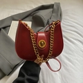 Vintage burgundy half-moon crossbody bag with gold chain strap and metal lock - Burgundy