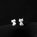 Macro shot of matte S925 silver cat earrings showing detailed texture and cute tail design - Silver