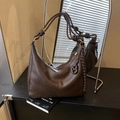 Chic dark brown faux leather hobo bag featuring a distinctive knotted shoulder strap - With Pendant / Brown