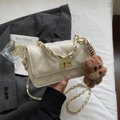 Beige quilted crossbody bag with gold chain strap and plush dog charm accessory - Cream White with Pendant