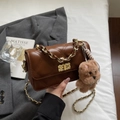 Brown quilted crossbody bag with gold chain strap and cute plush bear charm accessory - Brown with Pendant