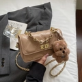 Quilted beige crossbody bag with gold chain strap and cute teddy bear charm - Khaki With Pendant