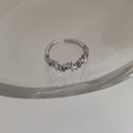 Macro detail of silver adjustable ring featuring purple and white starburst zircons - Irregular Star Ring / Silver/Purple