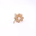 Golden flower napkin ring with central pearl and hollowed petals on white background - Gold Pearl Flower Napkin Ring