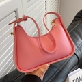 Chic pink faux leather crescent underarm bag with gold-tone hardware and adjustable strap - Rose Pink