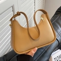 Minimalist khaki leather crescent shoulder bag with smooth texture and metallic zipper - Khaki