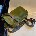 Retro green faux leather pillow bag featuring a wide bohemian style printed shoulder strap - Green