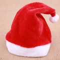Cappello di Babbo Natale in peluche rosso con bordo in pelliccia su sfondo di iuta - Peluche Corto Taglia Bambino
