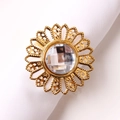 Macro detail of sunflower napkin ring with large central crystal and gold metal petals - Antique Gold Sunflower Napkin Ring