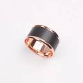 Detail of a minimalist black and rose gold napkin ring with matte and polished finishes - Rose Gold Trim Napkin Ring