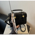 Detail of black vintage crossbody bag with gold buckle and woven rope accessory - Black with Pendant
