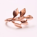 Detail of rose gold olive leaf napkin ring showing polished metallic finish and texture - Rose Gold (Large Polished)